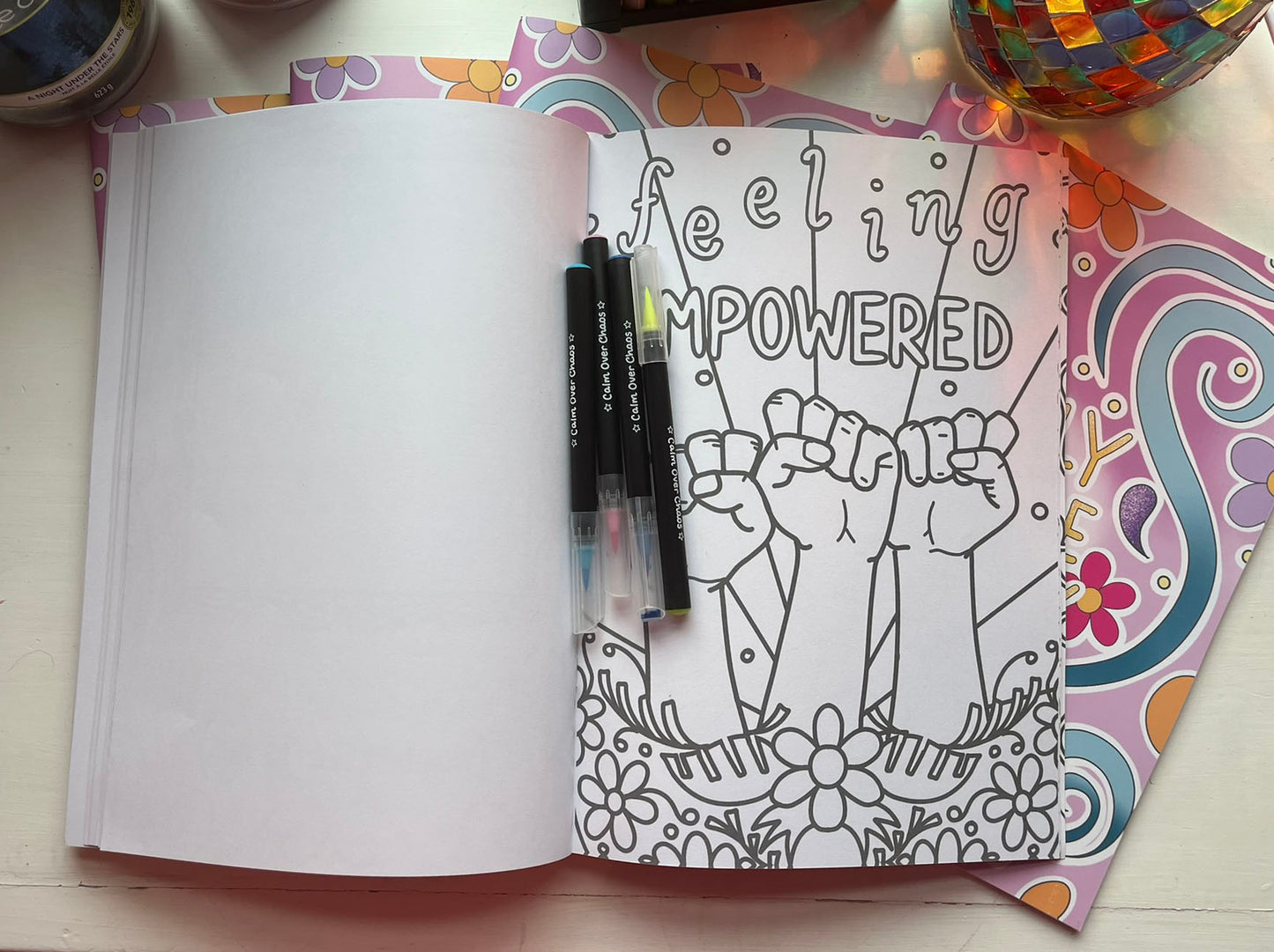 a page from daily dose of joy, it shows 3 fists pumping the air and says 'feeling empowered'
