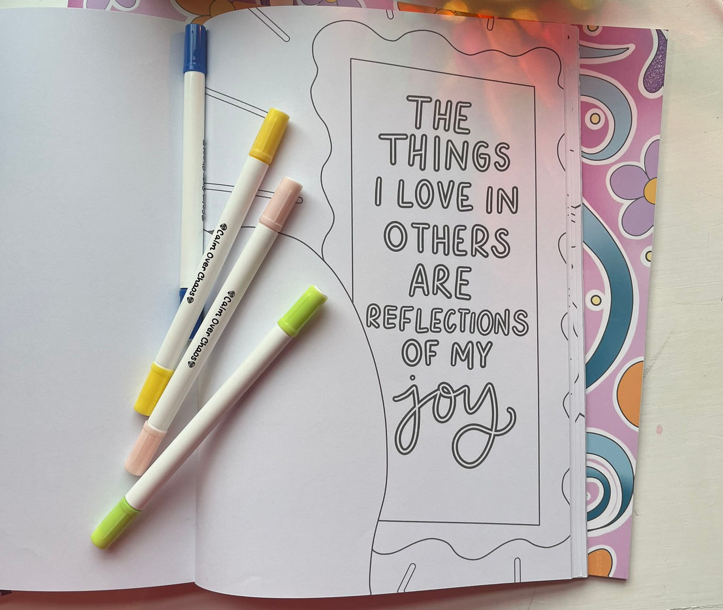a page from daily dose of joy, it shows a mirror that says 'the things i love in others are reflections of my joy'